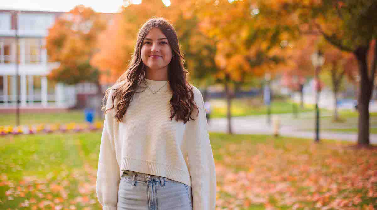 Photo of Elsie Bennett standing on the Merrimack quad.