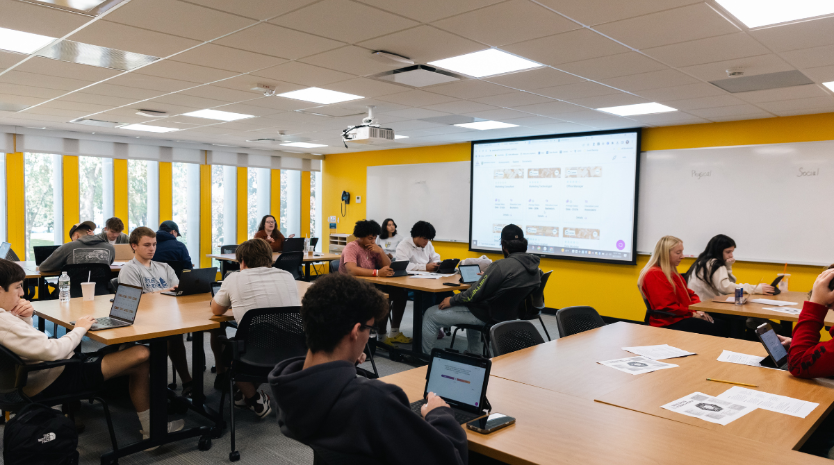 Photo of Merrimack students studying inside a classroom.