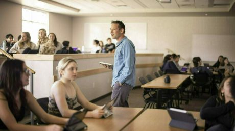 Photo of a Merrimack professor teaching a class.